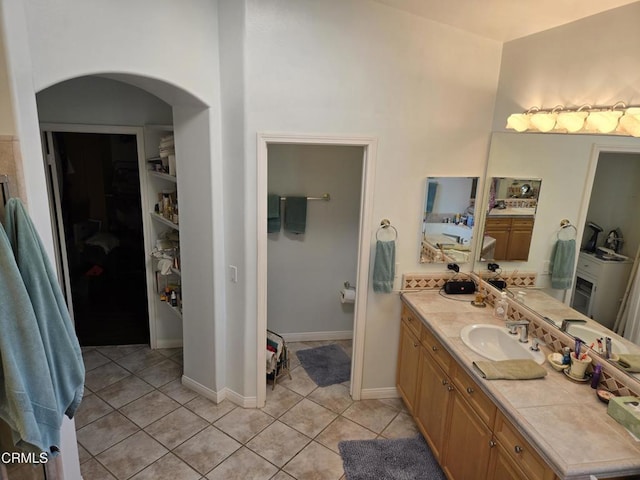 bathroom with vanity and tile patterned floors