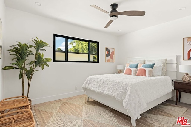 bedroom featuring light wood-type flooring and ceiling fan