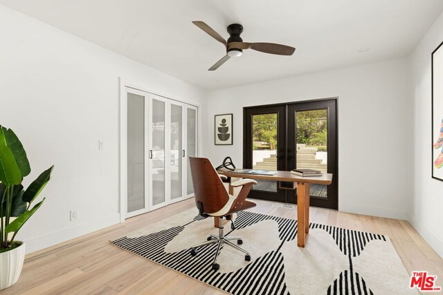 office area with ceiling fan, french doors, and light wood-type flooring