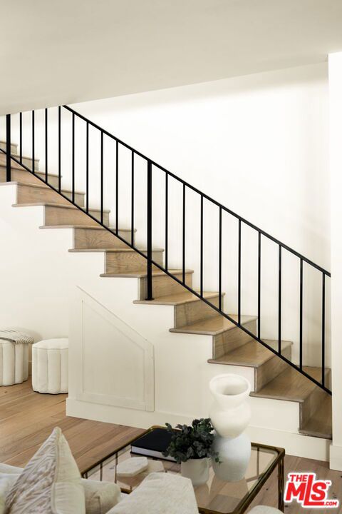 staircase featuring hardwood / wood-style floors