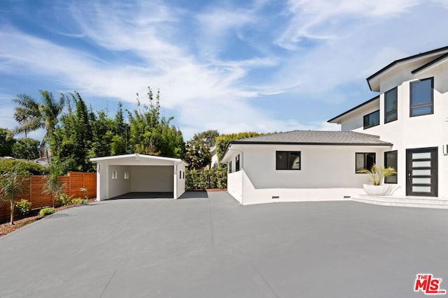 view of side of home featuring a carport