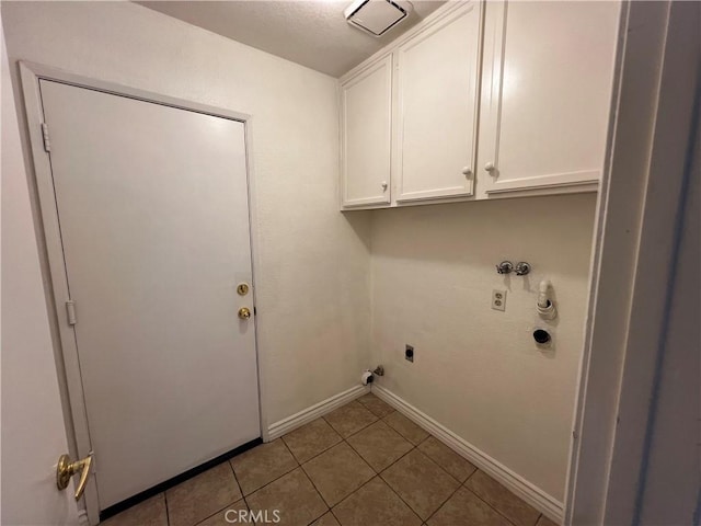 laundry room featuring cabinets, hookup for a washing machine, tile patterned flooring, and electric dryer hookup