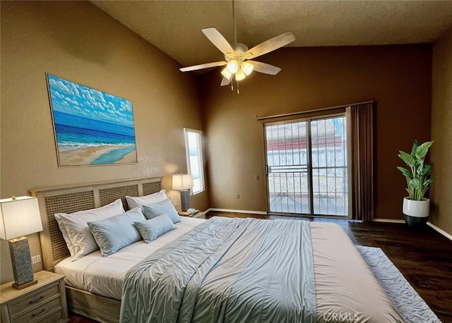 bedroom with access to exterior, dark hardwood / wood-style floors, ceiling fan, and lofted ceiling