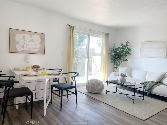 dining area featuring breakfast area and wood-type flooring