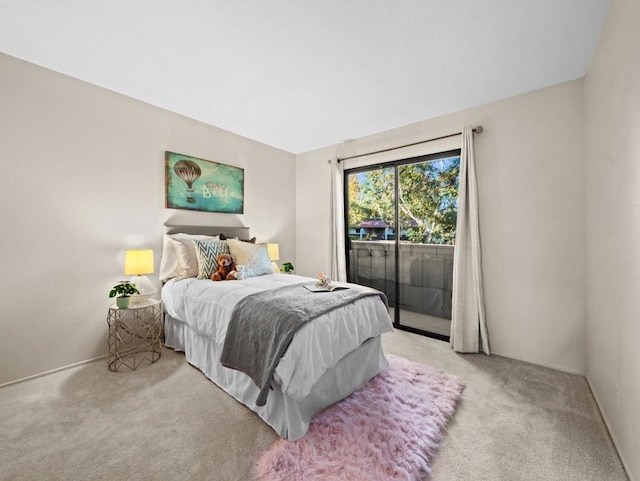 bedroom featuring light carpet and access to outside