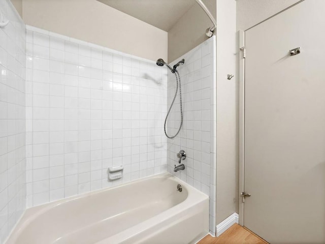 bathroom featuring shower / bath combination and wood-type flooring