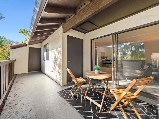 view of patio featuring a balcony