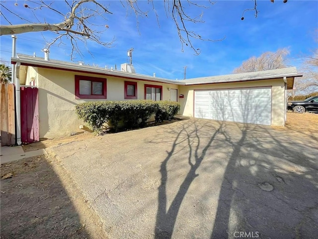 ranch-style house featuring a garage