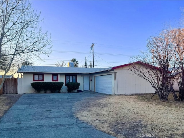 single story home featuring a garage