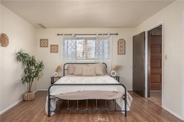 bedroom featuring dark hardwood / wood-style floors