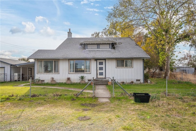 bungalow with a front yard and a carport