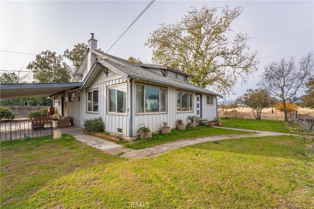 view of property exterior with a yard