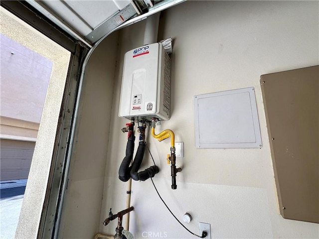 utility room with water heater and electric panel