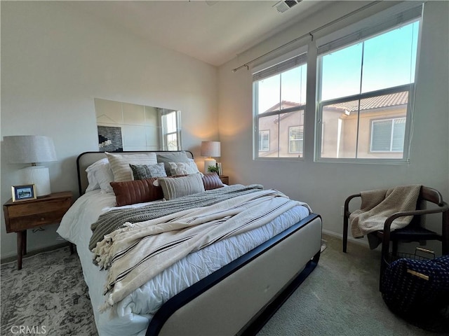 bedroom featuring lofted ceiling and light colored carpet