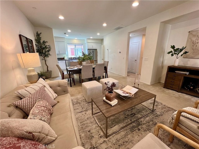 living room featuring light colored carpet