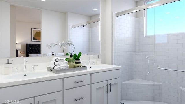 full bathroom with double vanity, a stall shower, and a sink