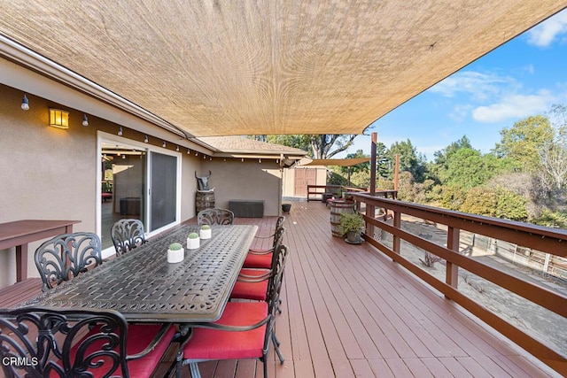 deck featuring outdoor dining area