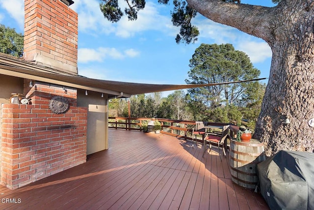 wooden deck featuring area for grilling