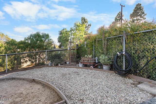 view of property's community with fence