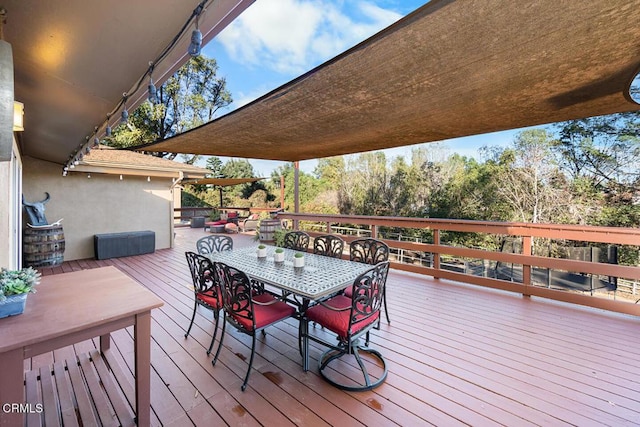 wooden deck with outdoor dining space