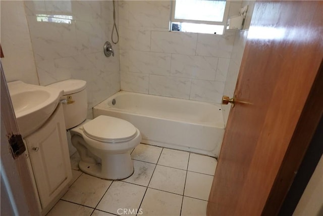 full bathroom featuring tiled shower / bath combo, tile patterned floors, vanity, and toilet