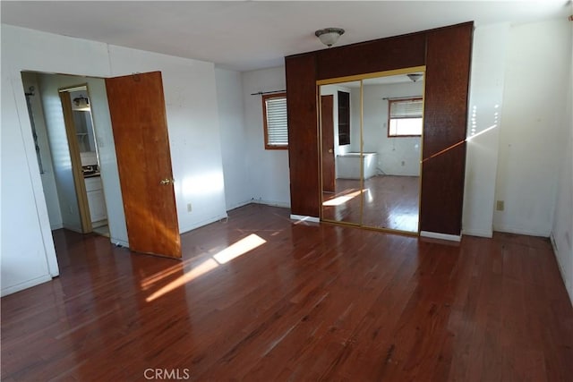 empty room featuring dark hardwood / wood-style flooring