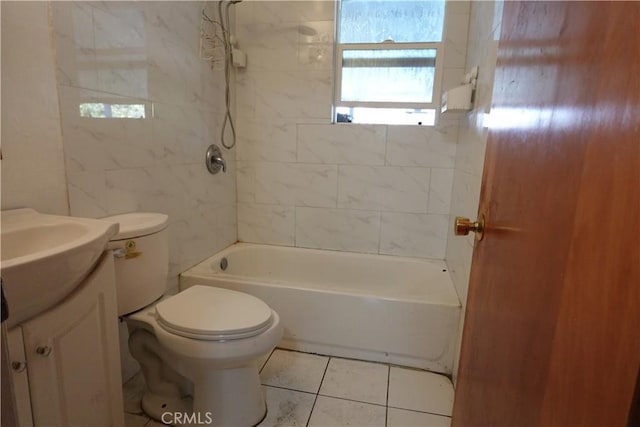 full bathroom featuring toilet, tile patterned flooring, tiled shower / bath, and vanity