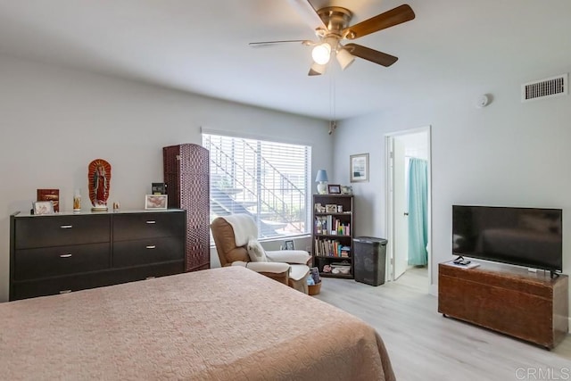 bedroom with light wood-type flooring and ceiling fan