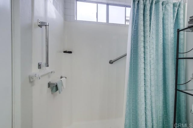 bathroom featuring walk in shower