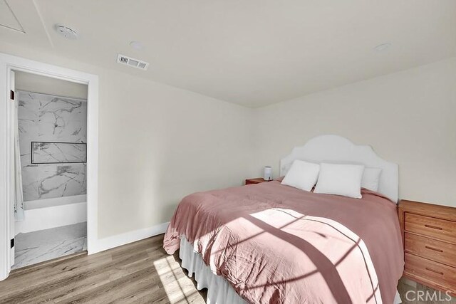 bedroom featuring hardwood / wood-style flooring