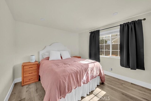 bedroom featuring light wood-type flooring