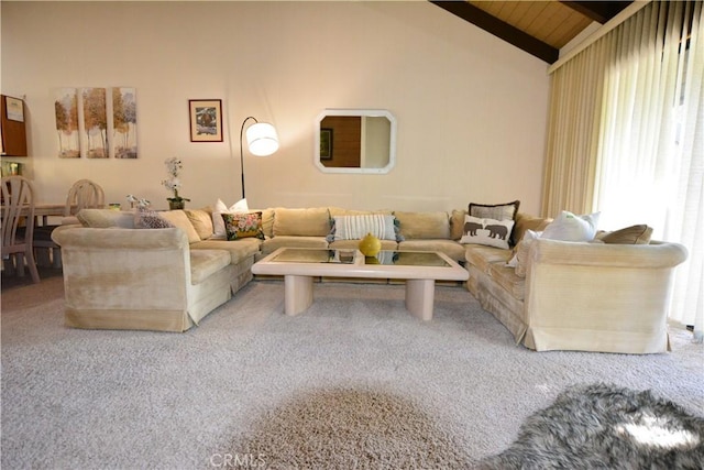 carpeted living room featuring beamed ceiling, high vaulted ceiling, and wooden ceiling