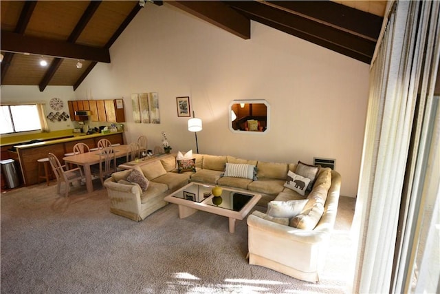 carpeted living room featuring beamed ceiling, wood ceiling, and high vaulted ceiling