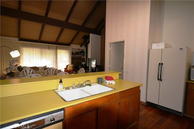 kitchen featuring wood ceiling, sink, white refrigerator, lofted ceiling with beams, and dishwasher