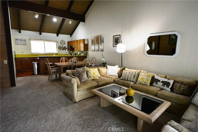 carpeted living room featuring beam ceiling, high vaulted ceiling, and wood ceiling