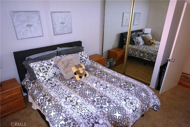 bedroom with carpet flooring and a closet