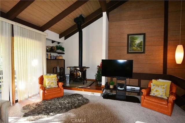 living room featuring lofted ceiling with beams, a wood stove, and wood ceiling