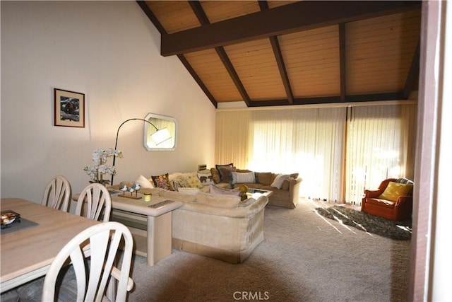 carpeted living room with vaulted ceiling with beams and wooden ceiling