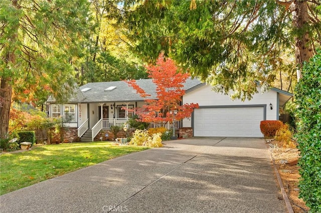 view of front facade featuring covered porch, a garage, and a front lawn