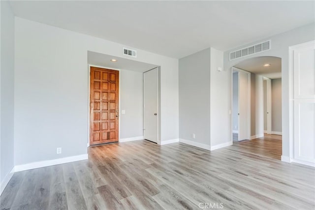 empty room with light hardwood / wood-style floors