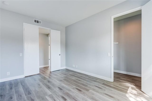 empty room with light wood-type flooring