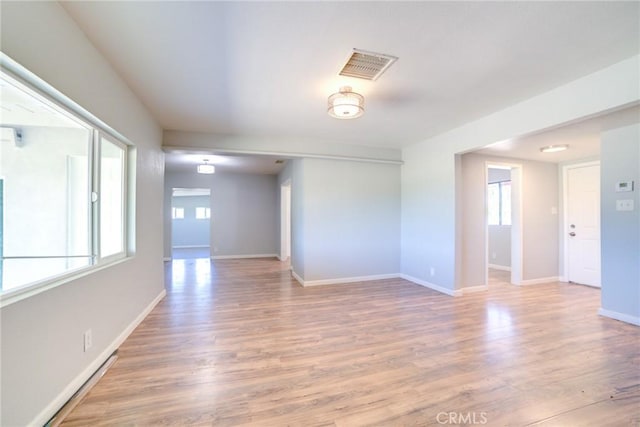 unfurnished room featuring hardwood / wood-style floors