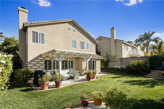 back of house with a lawn, an outdoor living space, a pergola, and a patio area