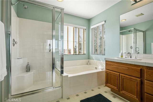 bathroom featuring vanity and plus walk in shower