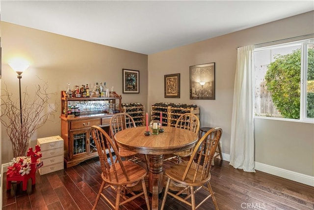 dining room with dark hardwood / wood-style floors