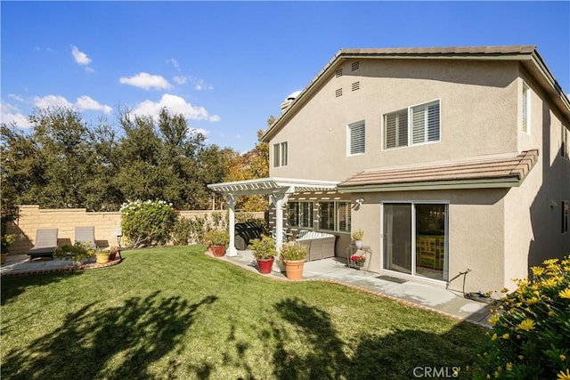 back of property featuring a pergola, a patio area, and a lawn