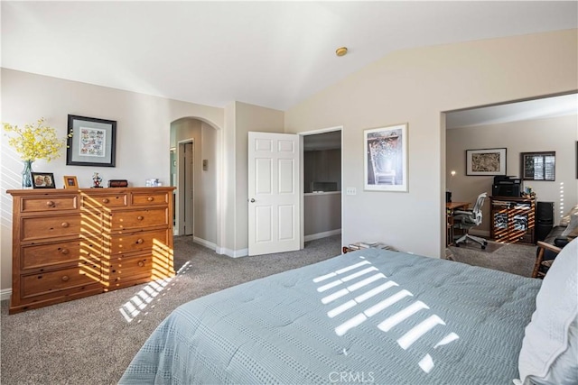 carpeted bedroom with lofted ceiling