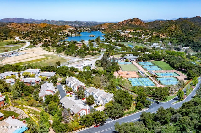 bird's eye view with a water and mountain view