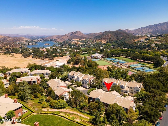 birds eye view of property featuring a water and mountain view