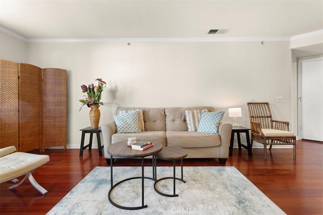 living room with crown molding and dark wood-type flooring